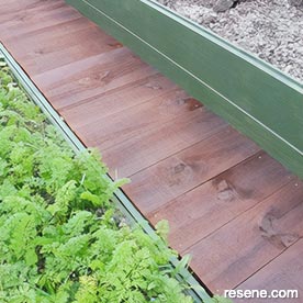 Build a boardwalk between two raised beds