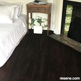 Partly stained wooden floor 