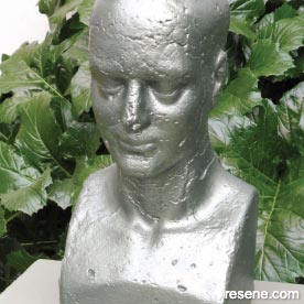 Metallic finish on a concrete statue