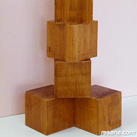 Create a cubist wooden sculpture