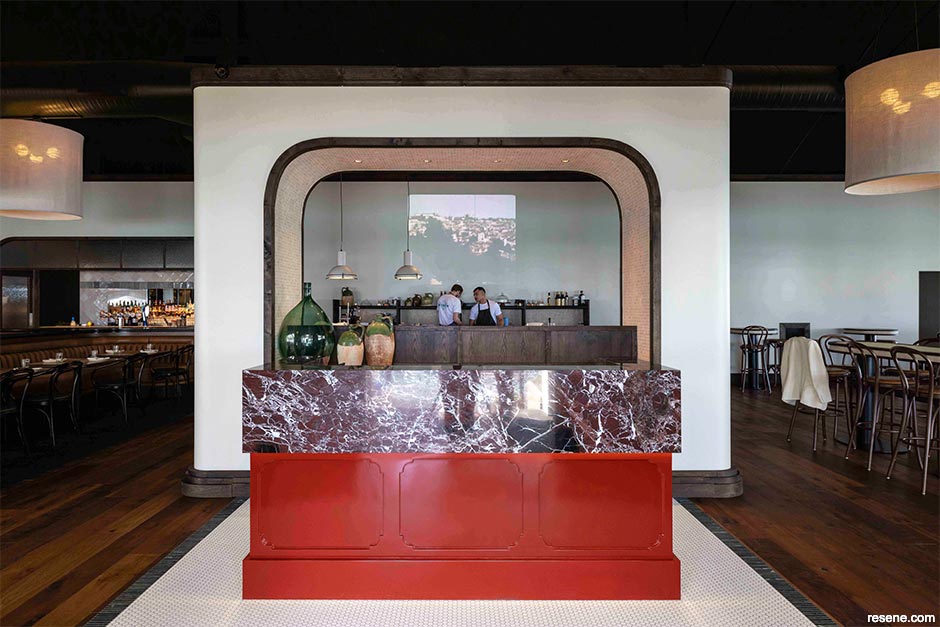 A bold red host desk