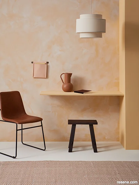 Lime-washed effect on interior walls painted in soft sunset shades
