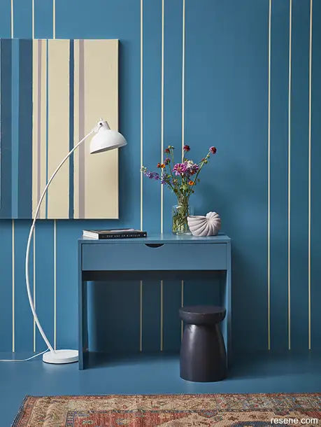 A constrasting blue and yellow striped wall