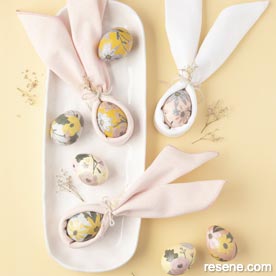 Make eggs with paper cutouts and bunny ears