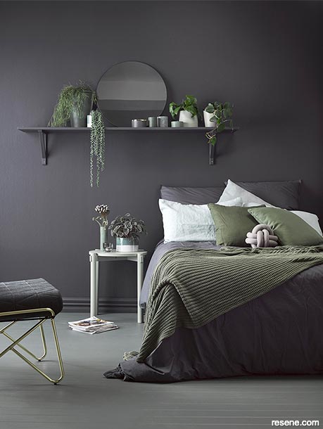 A bedroom painted with dark paint colours