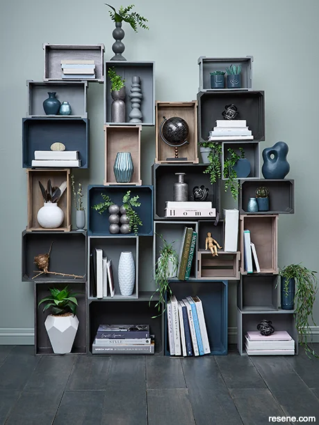 DIY crate shelving unit with metallic-finished crates and accessories