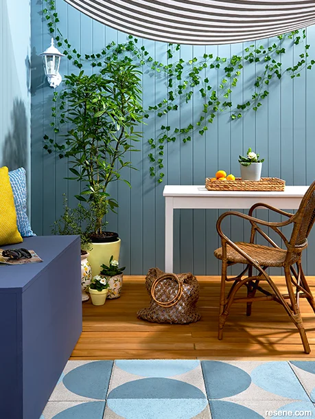 A Hamptons style patio decorated with coastal accessories