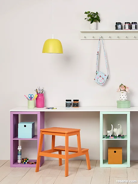 Kids craft room decorated with bold 70s hues in orange, yellow, and purple