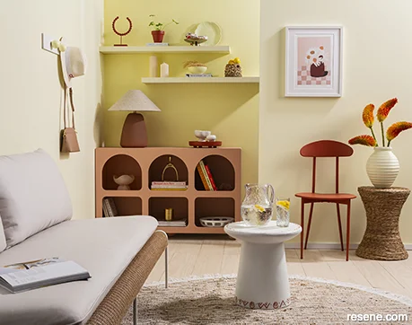 A living room painted in uplifitng yellows and reds