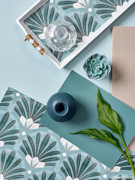 A modern Art Deco style moodboard with grey-blue paint swatches and bold wallpaper