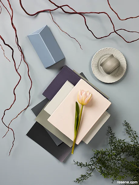 A moodboard showcasing bold hues and living room accessories and furniture