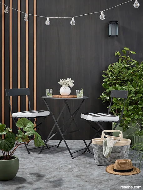 A moody outdoor area with biophilic finishes