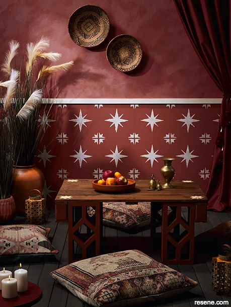 An outdoor area painted in Moroccan-inspired hues, styled with eclectic charm
