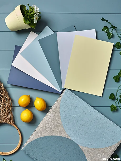 Outdoor Hamptons-style moodboard featuring coastal colors and elegant patio accessories