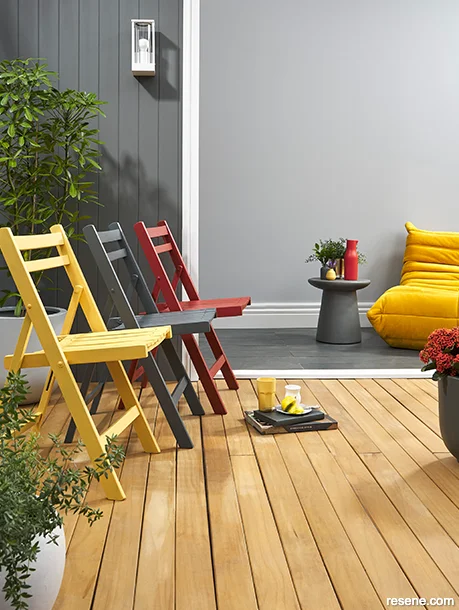 A patio with vibrant mustard yellow accessories