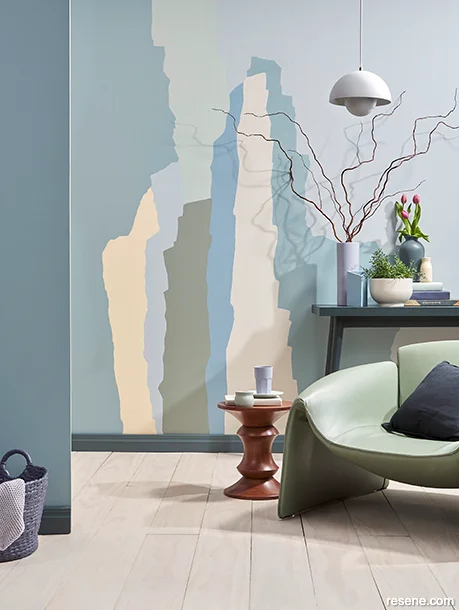 A living room with an abstract roller wall mural