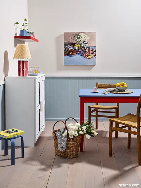 A Scandi-chic style dining room - bold primary colours on accessories