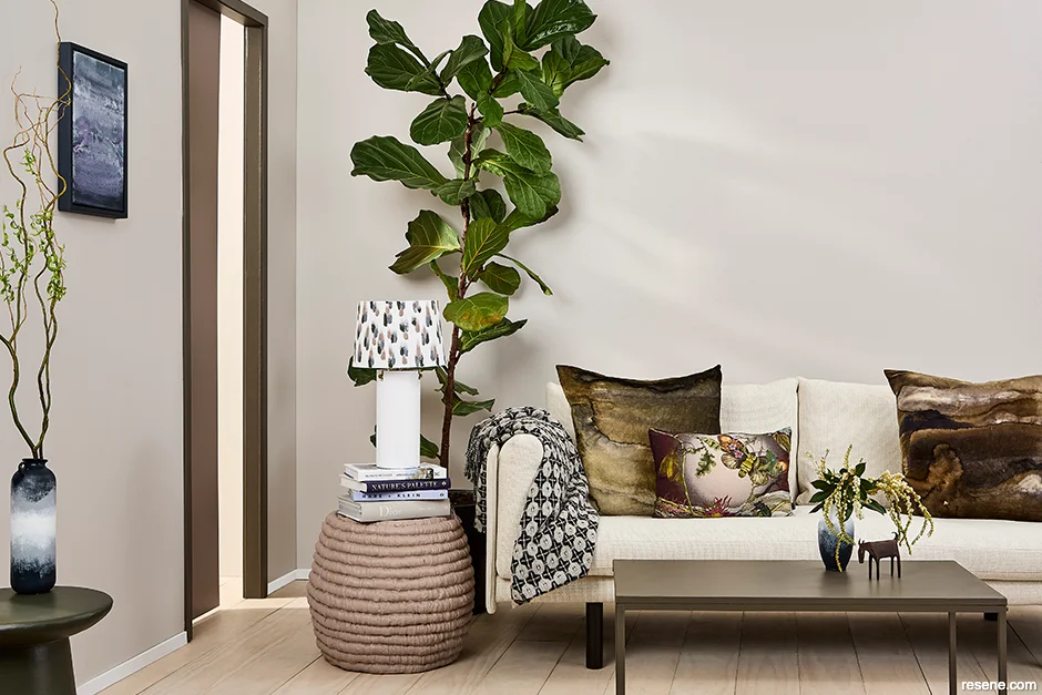A sophisticated lounge painted in warm neutrals such as Resene Quarter Perfect Taupe