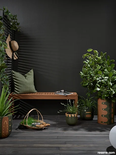 A stylish wellness deck painted and stained with dark hues