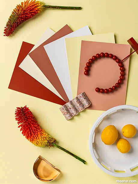 A moodboard showing uplifting summery hues - yellows and reds
