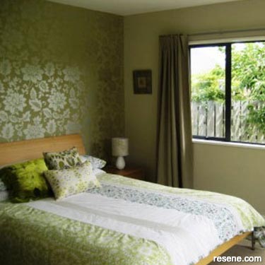 Repainted and wallpapered bedroom
