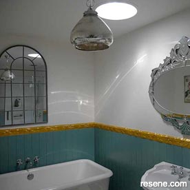 Green, white, and gold bathroom