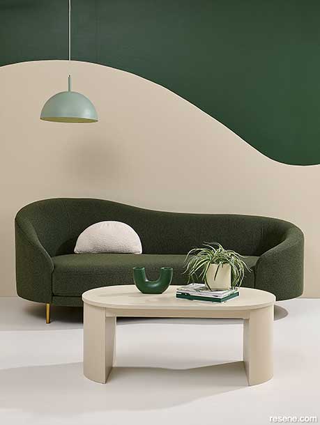 A unque 2-tone painted wall using Resene Forest Green and Resene Fossil