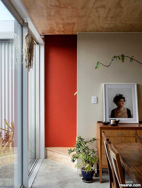 A bold red feature wall in a stairway in Resene Red Red Red