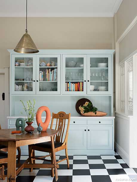 A pale blue freestanding kitchen storage unit in Resene Nebula