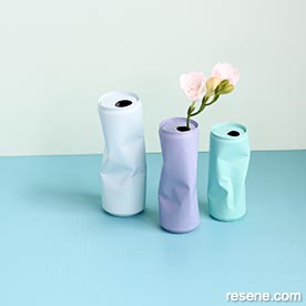 Upcycle crumpled cans into arty vases