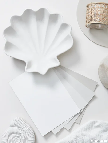 Coastal style moodboard with off-white paint swatches and accessories