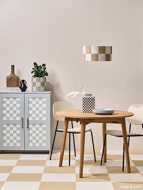 A dining room with a checkerboard floor pattern