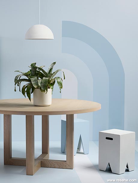 Light blue and white dining room, rainbow mural