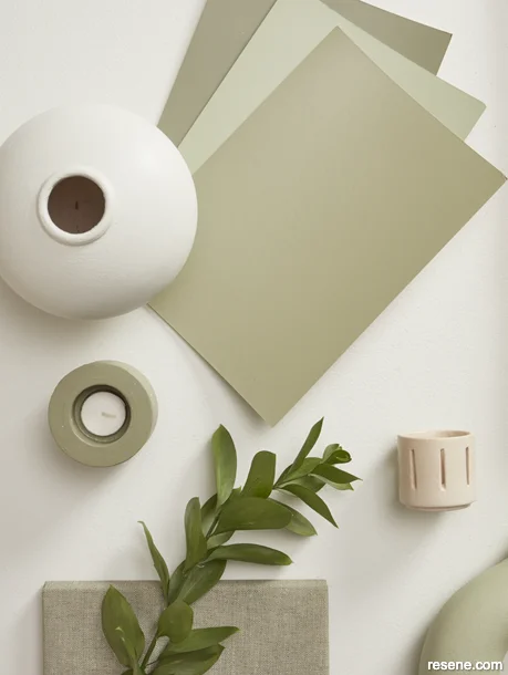 A winter themed moodboard featuring muted greens and neutrals