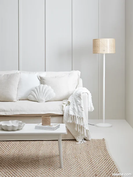 Modern coastal lounge painted with fresh off-whites