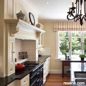 A modern kitchen in warm neutrals in an old villa
