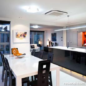 A sleek kitchen with vivid colour contrasts