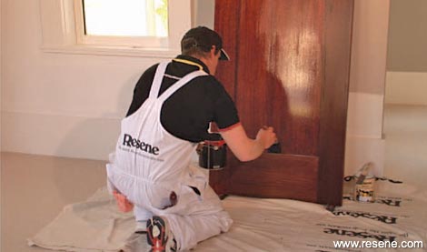 Varnishing the centre panel 