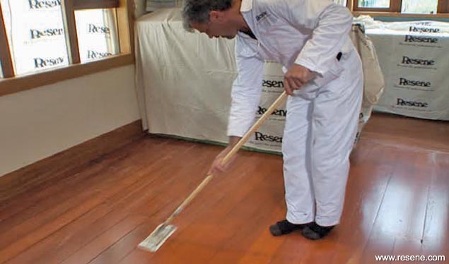 Lightly sand before the final coat of polyurethane on the floor
