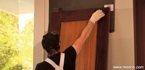 Applying the stain to the door reveals