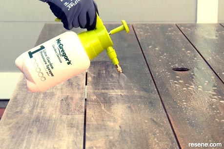 Saturating the timber with Resene Timber and Deck Wash