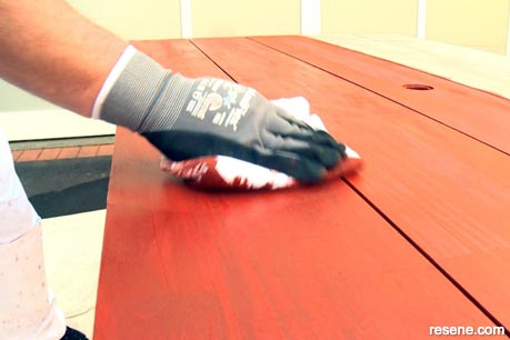 Wiping the timber to remove any marks