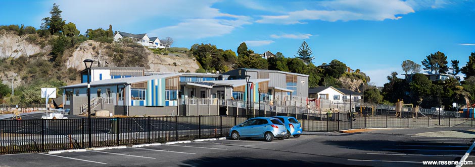 Green, blue, and white school exterior