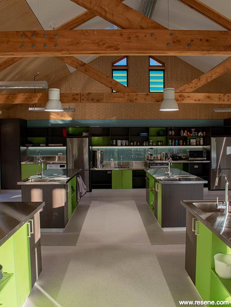 A green, black, and blue school kitchen
