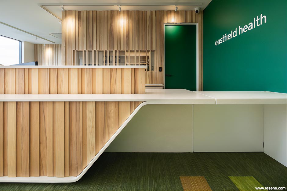Dark green and white reception area