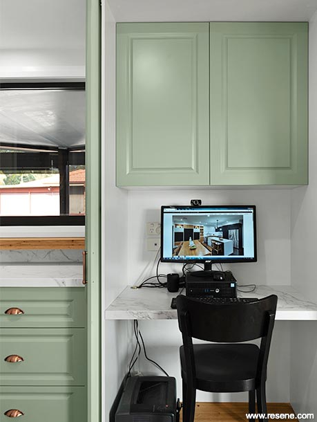 Green and white home office space