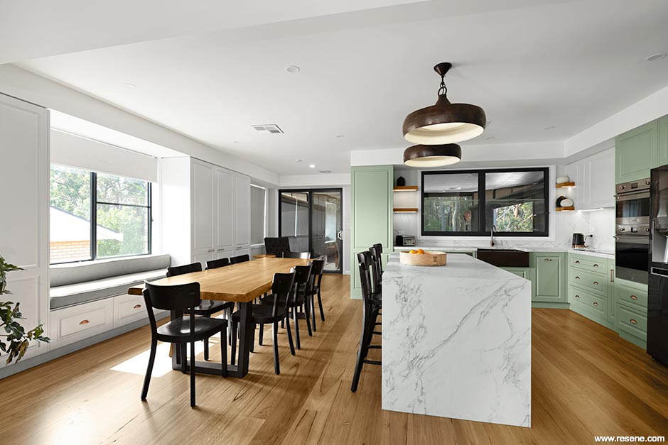 Green and white kitchen and dining room