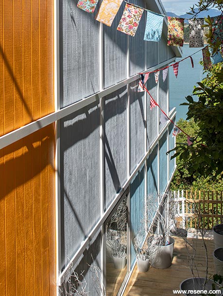 Orange, white, and blue beach home exterior