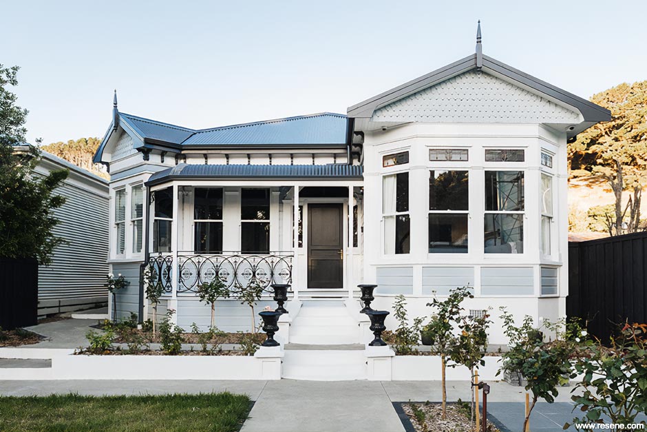 A blue grey and white villa exterior
