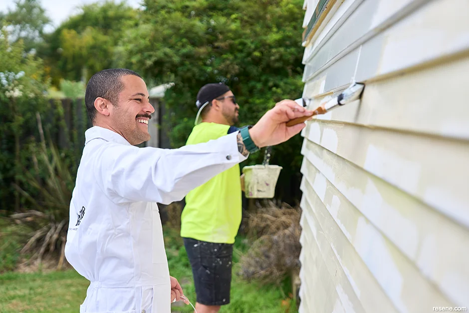 Unlock Painters painting a house exterior